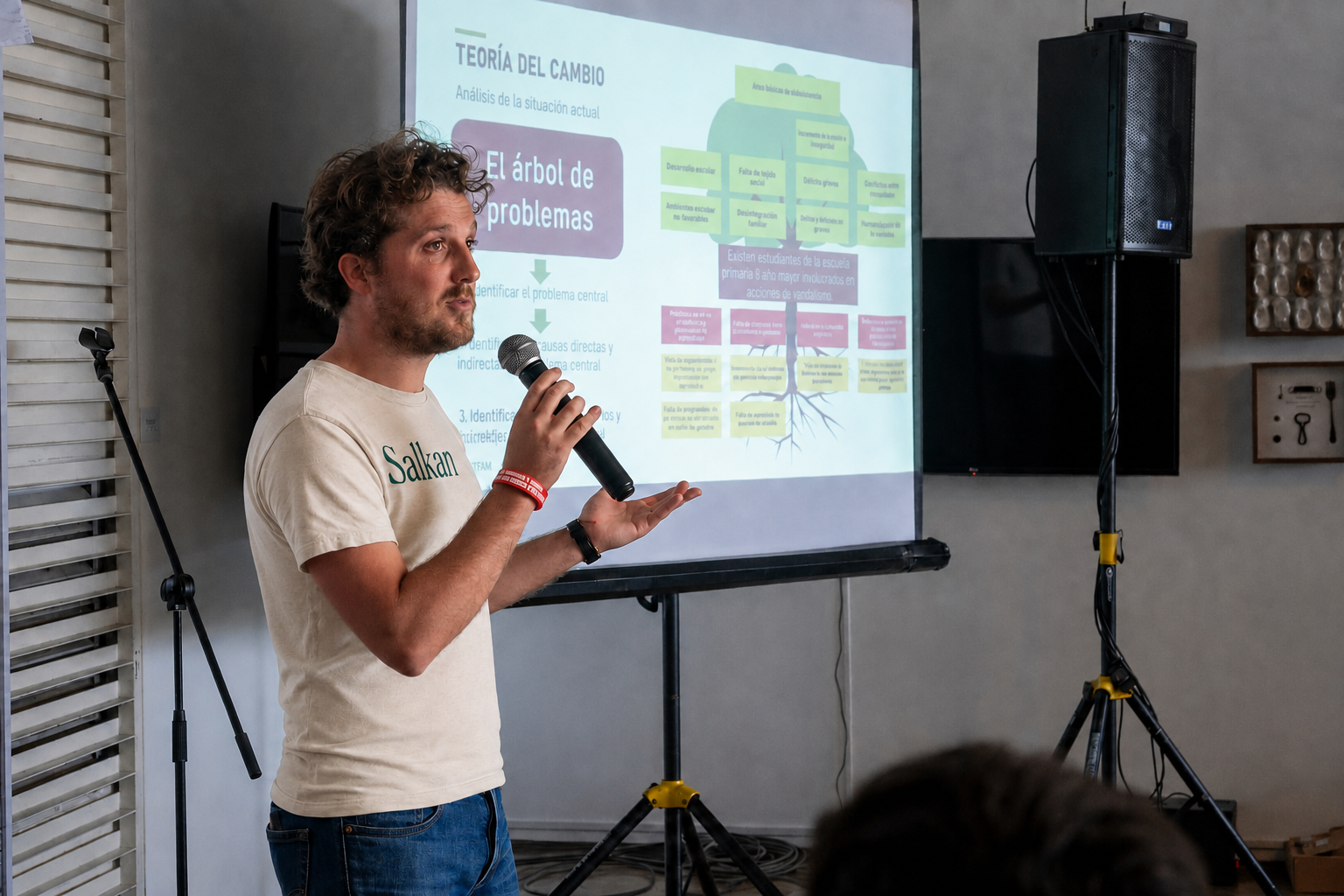 Xavier de Briey presenting a Theory of Change during a workshop, wearing a Salkan T-shirt